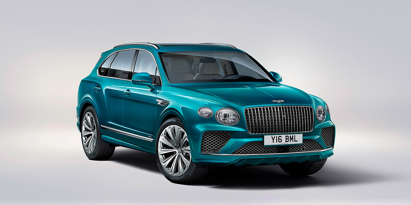 Bentley Maastricht Bentley Bentayga Azure front three-quarter view, featuring a fluted chrome grille with a matrix lower grille and chrome accents in Topaz blue paint.