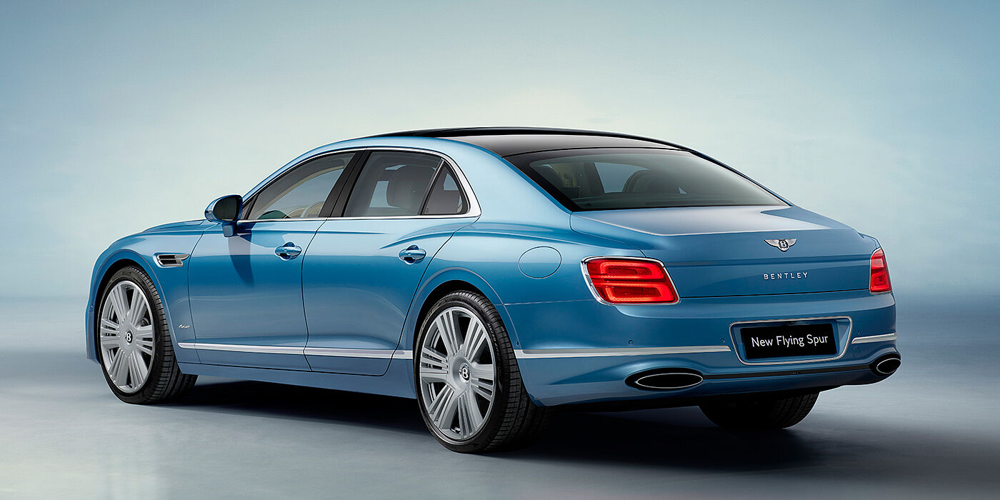 Bentley Maastricht New Bentley Flying Spur Azure sedan rear view in Light windsor blue by Mulliner paint with 22 inch Azure wheels and chrome exterior details
