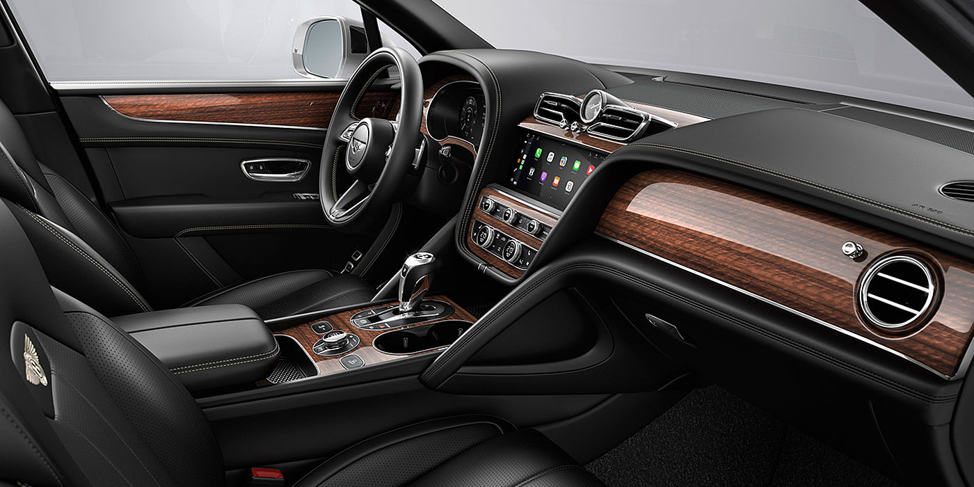 Bentley Maastricht Bentley Bentayga interior with a Crown Cut Walnut veneer, view from the passenger seat over looking the driver's seat.