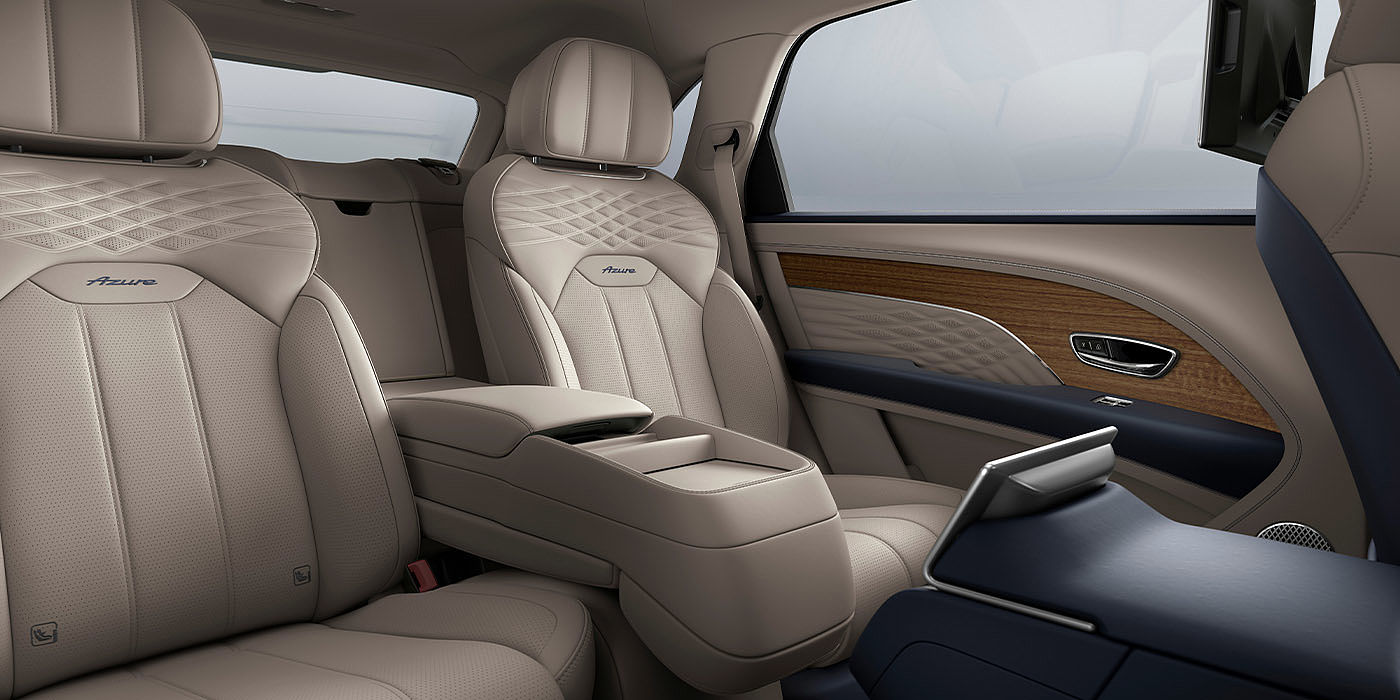Bentley Maastricht Bentley Bentayga EWB Azure interior view for rear passengers with Portland hide featuring Azure Emblem in Imperial Blue contrast stitch.