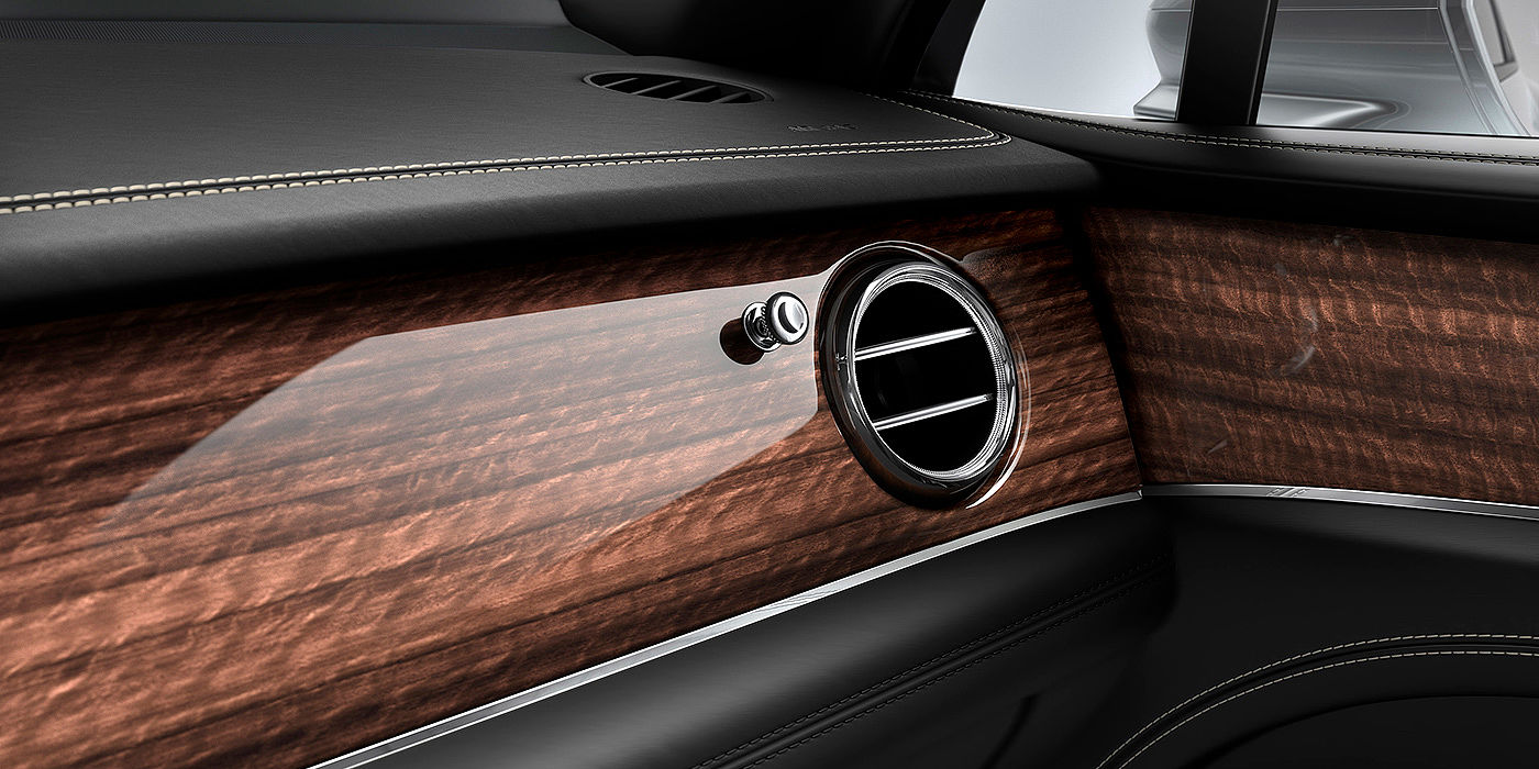 Bentley Maastricht Bentley Bentayga front interior Crown Cut Walnut veneer and chrome air vent.