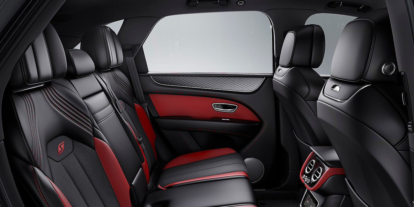 Bentley Maastricht Bentey Bentayga S interior view for rear passengers with Beluga black and Hotspur red coloured hide.
