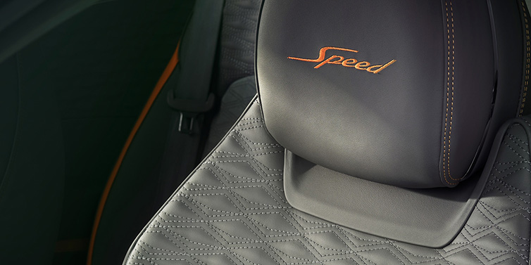 Bentley Maastricht Bentley Continental GT Speed coupe seat detail in Gravity Grey hide and Speed emblem in Mandarin by Mulliner coloured embroidery